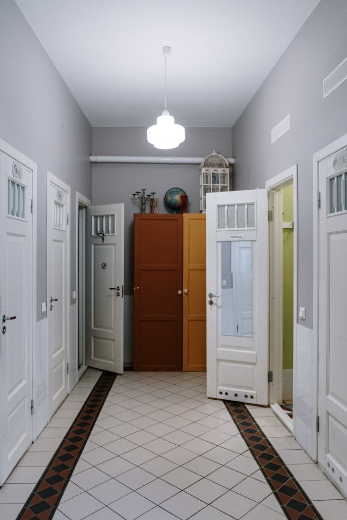 The Art of Drawing Readers In: Your attractive post title goes here A modern corridor featuring open doors and decorative cabinets.